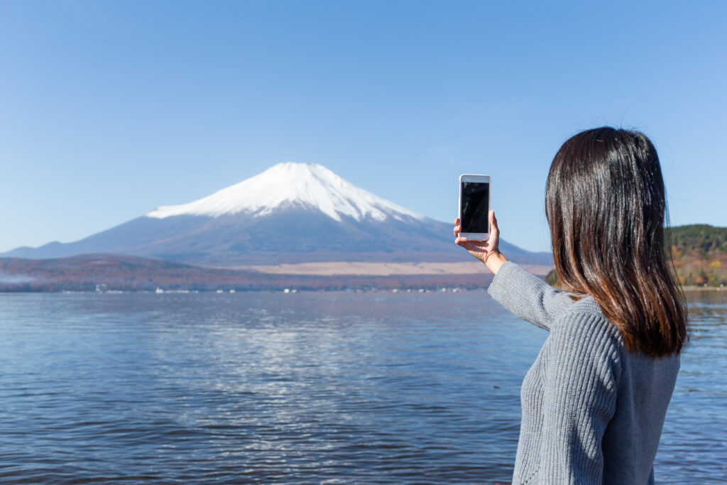 Woman,Taking,Photo,Of,Mountain,Fuji